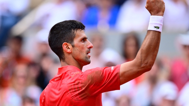 TOPSHOT - Serbia's Novak Djokovic celebrates a point against Norway's Casper Ruud during their men's singles final match on day fifteen of the Roland-Garros Open tennis tournament at the Court Philippe-Chatrier in Paris on June 11, 2023. (Photo by Emmanuel DUNAND / AFP)