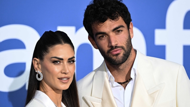 Italian tv presenter Melissa Satta (L) and Italian tennis player Matteo Berrettini arrive to attend the annual amfAR Cinema Against AIDS Cannes Gala at the Hotel du Cap-Eden-Roc in Cap d'Antibes, southern France, on the sidelines of the 76th Cannes Film Festival, on May 25, 2023. (Photo by Stefano Rellandini / AFP)