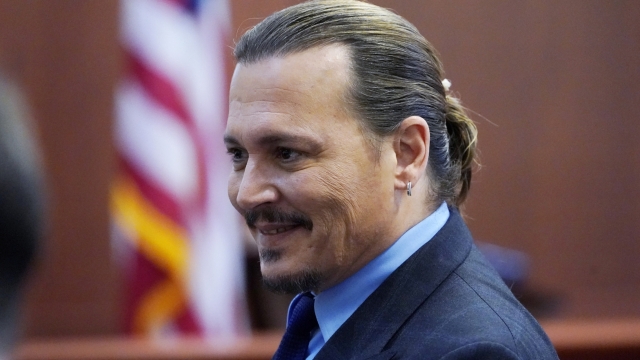 FILE - Johnny Depp walks to a lunch break at the Fairfax County Circuit Court in Fairfax, Va., Monday May 2, 2022. Actors Depp and Amber Heard have settled their defamation lawsuits following a high-profile trial earlier this year in which the former couple accused each other of physical and verbal abuse. Heard announced the settlement Monday, Dec. 19, on social media. (AP Photo/Steve Helber, Pool, File)