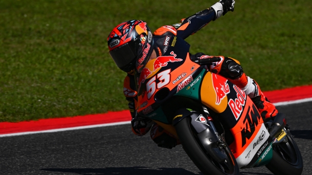 Red Bull KTM Ajo Turkish rider Deniz Oncu gestures as he compete during the Italian Moto3 Grand Prix race at Mugello Circuit in Mugello, on June 11, 2023. (Photo by Filippo MONTEFORTE / AFP)