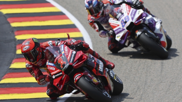Italy's Francesco Bagnaia, of the Ducati Lenovo team, left, rides ahead of Spain's Jorge Martin, of the Prima Pramac Racing team, during the German Grand Prix, at the Sachsenring racing circuit, in Hohenstein-Ernstthal, Germany, Sunday, June 18, 2023. (Jan Woitas/dpa via AP)