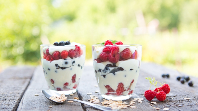 Natural yogurt with fresh raspberries, black currant and muesli. . Healthy dessert. Healthy food concept.