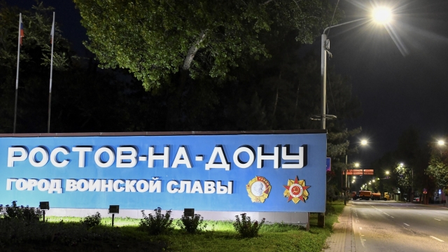 epa10709005 Trucks (R, back) block the access road to Rostov-on Don as a sign reads 'Rostov-on -Don City of Military Glory', southern Russia, 24 June 2023. Security and armoured vehicles were deployed after private military company (PMC) Wagner Groupâ??s chief Yevgeny Prigozhin said in a video that his troops had occupied the building of the headquarters of the Southern Military District, demanding a meeting with Russiaâ??s defense chiefs.  EPA/ARKADY BUDNITSKY