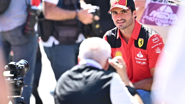 Ferrari's Spanish driver Carlos Sainz Jr. poses for a photographer at the Red Bull race track in Spielberg, Austria on June 29, 2023, ahead of the Austrian Formula One Grand Prix. (Photo by Joe Klamar / AFP)