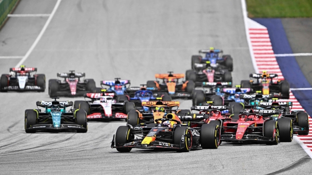 TOPSHOT - Red Bull Racing's Dutch driver Max Verstappen (C) takes the lead during the Formula One Austrian Grand Prix at the Red Bull race track in Spielberg, Austria on July 2, 2023. (Photo by Joe Klamar / AFP)
