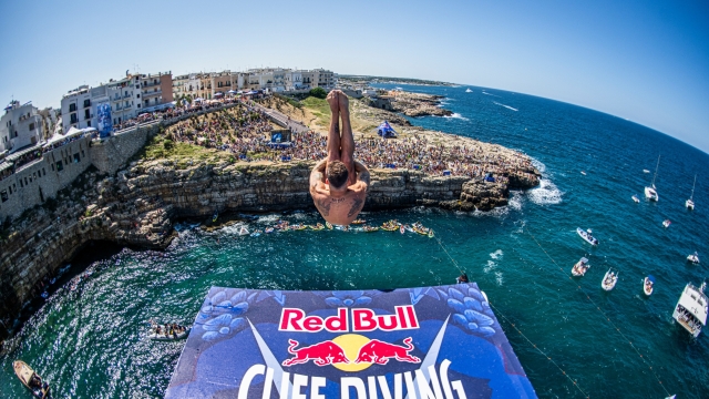 Alessandro De Rose of Italy dives from the 27.5 metre platform during the final competition day of the third stop of the Red Bull Cliff Diving World Series in Polignano a Mare, Italy on July 2, 2023. // Romina Amato / Red Bull Content Pool // SI202307020560 // Usage for editorial use only //