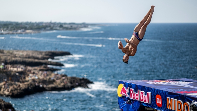 Aidan Heslop of the UK dives from the 27.5 metre platform during the final competition day of the third stop of the Red Bull Cliff Diving World Series in Polignano a Mare, Italy on July 2, 2023. // Dean Treml / Red Bull Content Pool // SI202307020588 // Usage for editorial use only //