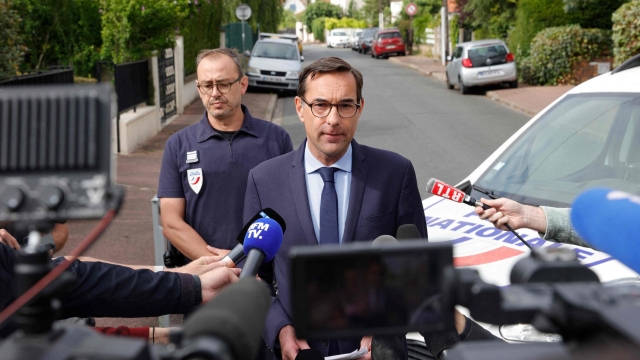 French prosecutor Stephane Hardouin (C) addresses the press near the damaged home of the Mayor of l'Hay-les-Roses, in l'Hay-les-Roses, a suburb of Paris on July 2, 2023, after rioters rammed a vehicle into the building injuring the Mayor's wife and one of his children overnight, during continued disturbances across France after a 17-year-old man was killed by police in Nanterre, a western suburb of Paris on June 27. Mayor Vincent Jeanbrun wrote on Twitter that protesters "rammed a car" into his home before "setting a fire" while his family slept. (Photo by Geoffroy Van der Hasselt / AFP)