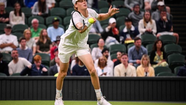 CORRECTION / Italy's Jannik Sinner returns the ball to Argentina's Francisco Cerundolo during their men's singles tennis match on the first day of the 2023 Wimbledon Championships at The All England Tennis Club in Wimbledon, southwest London, on July 3, 2023. (Photo by Daniel LEAL / AFP) / RESTRICTED TO EDITORIAL USE / The erroneous mention[s] appearing in the metadata of this photo by Daniel LEAL has been modified in AFP systems in the following manner: [Italy's Jannik Sinner returns the ball to Argentina's Francisco Cerundolo] instead of [Germany's Yannick Hanfmann returns the ball to US player Taylor Fritz]. Please immediately remove the erroneous mention[s] from all your online services and delete it (them) from your servers. If you have been authorized by AFP to distribute it (them) to third parties, please ensure that the same actions are carried out by them. Failure to promptly comply with these instructions will entail liability on your part for any continued or post notification usage. Therefore we thank you very much for all your attention and prompt action. We are sorry for the inconvenience this notification may cause and remain at your disposal for any further information you may require.