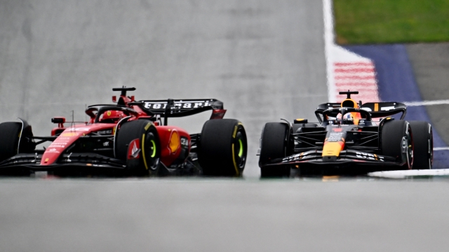 Red Bull Racing's Dutch driver Max Verstappen (R) competes with Ferrari's Monegasque driver Charles Leclerc during the Formula One Austrian Grand Prix at the Red Bull race track in Spielberg, Austria on July 2, 2023. (Photo by Joe Klamar / AFP)