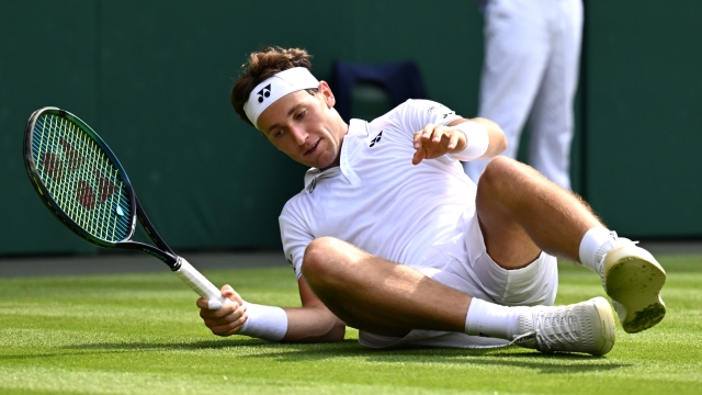 LONDON, ENGLAND - JULY 06: Casper Ruud of Norway falls against Liam Broady of Great Britain in the Men's Singles second round match during day four of The Championships Wimbledon 2023 at All England Lawn Tennis and Croquet Club on July 06, 2023 in London, England. (Photo by Mike Hewitt/Getty Images)