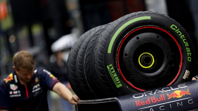 A technician pushes a cart with Cinturato intermediate tyres by Pirelli for the sprint shootout at the Red Bull race track in Spielberg, Austria on July 1, 2023, ahead of the Austrian Formula One Grand Prix. (Photo by ERWIN SCHERIAU / APA / AFP) / Austria OUT