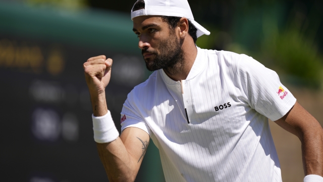 Italy's Matteo Berrettini reacts after winning a point against Australia's Alex de Minaur in a men's singles match on day five of the Wimbledon tennis championships in London, Friday, July 7, 2023. (AP Photo/Alberto Pezzali)