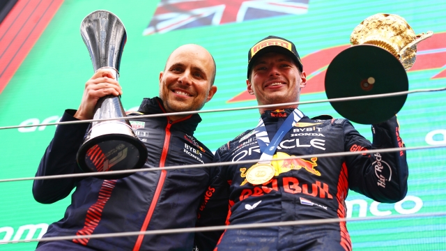 NORTHAMPTON, ENGLAND - JULY 09: Race winner Max Verstappen of the Netherlands and Oracle Red Bull Racing and Red Bull Racing race engineer Gianpiero Lambiase celebrate on the podium during the F1 Grand Prix of Great Britain at Silverstone Circuit on July 09, 2023 in Northampton, England. (Photo by Mark Thompson/Getty Images)