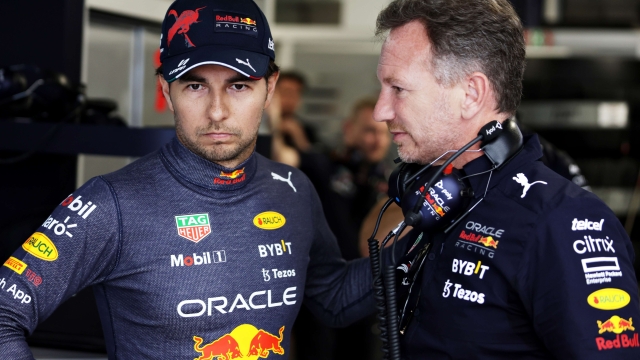 MIAMI, FLORIDA - MAY 08: Sergio Perez of Mexico and Oracle Red Bull Racing talks with Red Bull Racing Team Principal Christian Horner in the garage prior to the F1 Grand Prix of Miami at the Miami International Autodrome on May 08, 2022 in Miami, Florida.   Mark Thompson/Getty Images/AFP
== FOR NEWSPAPERS, INTERNET, TELCOS & TELEVISION USE ONLY ==