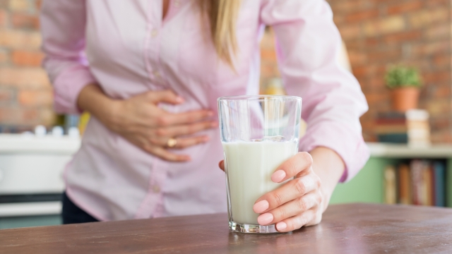 Woman feeling sick by drinking milk
