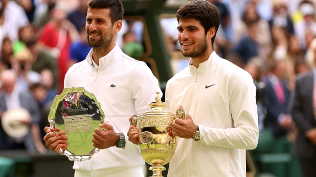 LONDON, ENGLAND - JULY 16: Novak Djokovic of Serbia (L) with the Men's Singles Runner's Up Plate alongside Carlos Alcaraz of Spain (R) and the Men's Singles Trophy the Men's Singles Final on day fourteen of The Championships Wimbledon 2023 at All England Lawn Tennis and Croquet Club on July 16, 2023 in London, England. (Photo by Clive Brunskill/Getty Images)