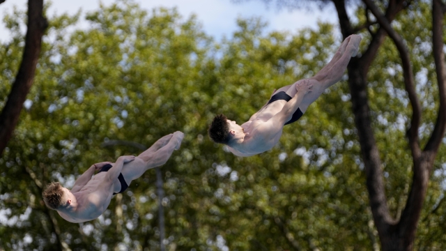 Anthony Harding and Jack Laugher of Britain dive during synchronised Men's 3m springboard competition, at the European aquatics, in Rome, Sunday Aug. 21, 2022. (AP Photo/Domenico Stinellis)