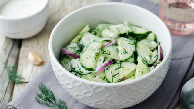 Greek yogurt red onion cucumber salad. toning. selective focus