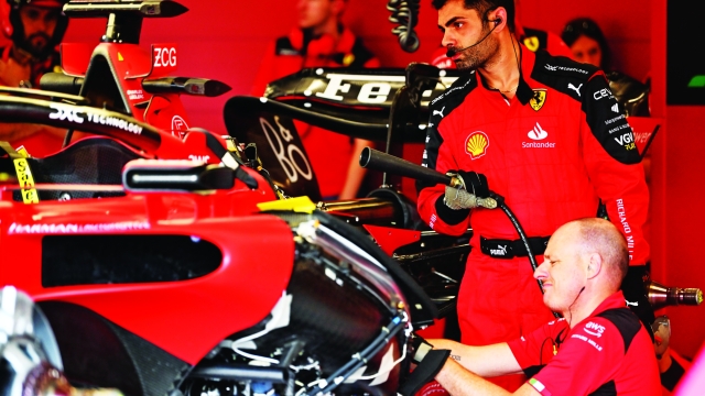 NORTHAMPTON, ENGLAND - JULY 07: The Ferrari team work on an issue on the car of Charles Leclerc of Monaco and Ferrari in the garage during practice ahead of the F1 Grand Prix of Great Britain at Silverstone Circuit on July 07, 2023 in Northampton, England. (Photo by Dan Mullan/Getty Images)