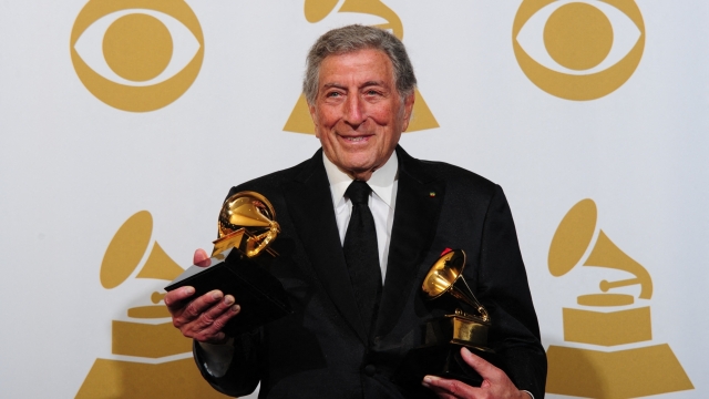 (FILES) Singer Tony Bennett poses with the trophies for Traditional Pop Vocal Album for "Duets II" and Best Pop Duo/Group Performance for "Body and Soul" at the 54th Grammy Awards in Los Angeles, California, February 12, 2012. Bennett, the last in a generation of classic American crooners whose ceaselessly cheery spirit bridged generations to make him a hitmaker across seven decades died on July 21, 2023, in New York, US media reported. He was 96. (Photo by Frederic J. BROWN / AFP)
