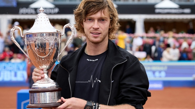Russia's Andrey Rublev celebrates with the trophy after winning the final at the Swedish Open ATP tennis tournament in Bastad, Sweden, on July 23, 2023. (Photo by Anders Bjuro / TT NEWS AGENCY / AFP) / Sweden OUT