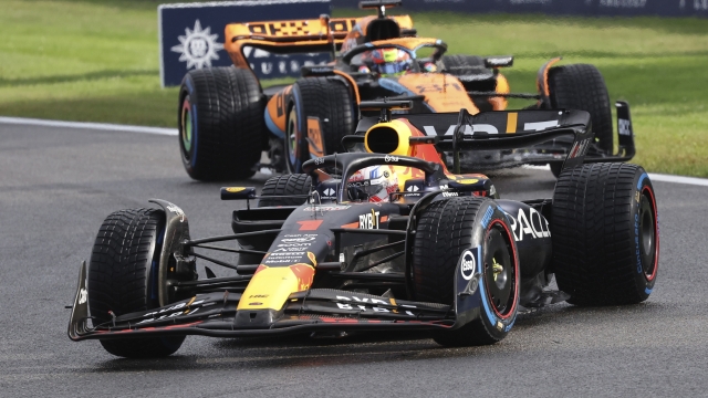 Red Bull driver Max Verstappen of the Netherlands, right, and McLaren driver Oscar Piastri of Australia steer their cars during the sprint race ahead of the Formula One Grand Prix at the Spa-Francorchamps racetrack in Spa, Belgium, Saturday, July 29, 2023. The Belgian Formula One Grand Prix will take place on Sunday. (AP Photo/Geert Vanden Wijngaert)