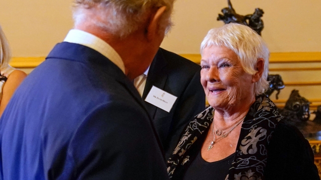 Britain's King Charles III speaks to Judi Dench (R) during a reception hosted by Britain's King Charles III and Britain's Queen Camilla at Windsor Castle in Windsor on July 18, 2023, on the 400th anniversary of the publication of the first Shakespeare Folio. (Photo by Andrew Matthews / POOL / AFP)