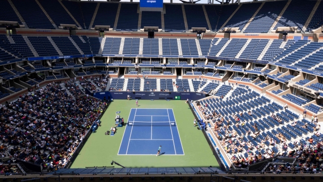 People attend a practice session during Arthur Ashe Kids' Day ahead of the 2022 US Open Tennis tournament at Louis Armstrong Stadium at the USTA Billie Jean King National Tennis Center in New York, on August 27, 2022. (Photo by KENA BETANCUR / AFP)