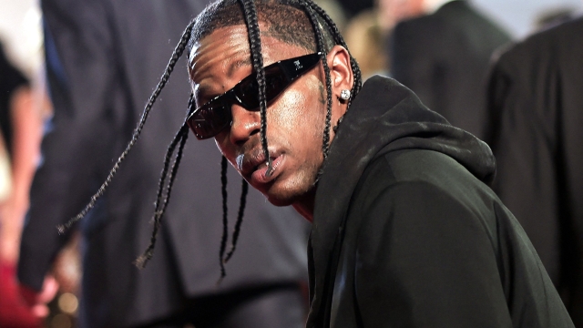 (FILES) US rapper Travis Scott arrives for the screening of the film "The Idol" during the 76th edition of the Cannes Film Festival in Cannes, southern France, on May 22, 2023. US rapper Travis Scott will not face criminal charges for the crowd movement that left ten people dead at the Astroworld festival he co-organized in Texas in November 2021, judicial authorities announced on June 29. "No criminal charges will be filed," Harris County District Attorney Kim Ogg's office said in a statement. (Photo by Valery HACHE / AFP)