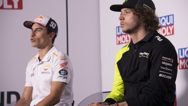 HOHENSTEIN-ERNSTTHAL, GERMANY - JUNE 15: Marc Marquez of Spain and Repsol Honda Team (L) speaks and Marco Bezzecchi of Italy and Mooney VR46 Racing Team looks on during the press conference pre-event during the MotoGP of Germany - Previews at Sachsenring Circuit on June 15, 2023 in Hohenstein-Ernstthal, Germany. (Photo by Mirco Lazzari gp/Getty Images)