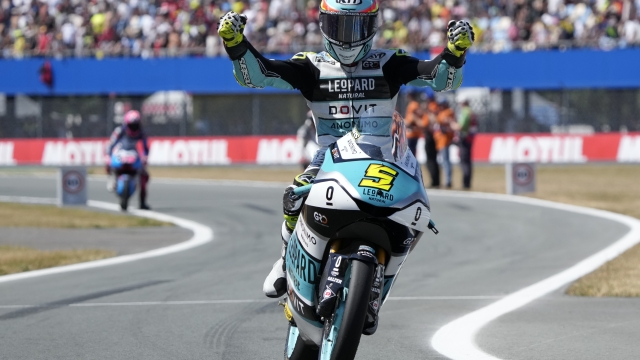 Spain's rider Jaume Masia celebrates after winning the Moto3 race at the Dutch Grand Prix in Assen, northern Netherlands, Sunday, June 25, 2023. (AP Photo/Peter Dejong)