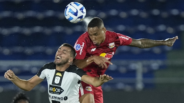 Natan of Brazil's Bragantino, right, and Jose Barros of Paraguay's Tacuary, battle for the ball during a Copa Sudamericana group C soccer match at Defensores del Chacho stadium in Asuncion, Paraguay, Thursday, April 6, 2023. (AP Photo/Jorge Saenz)