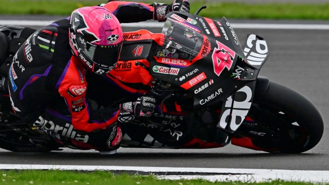 Eventual race winner, Aprilia Racing Spanish rider Aleix Espargro rides during the Moto GP race of the motorcycling British Grand Prix at Silverstone circuit in Northamptonshire, central England, on August 6, 2023. (Photo by Ben Stansall / AFP)