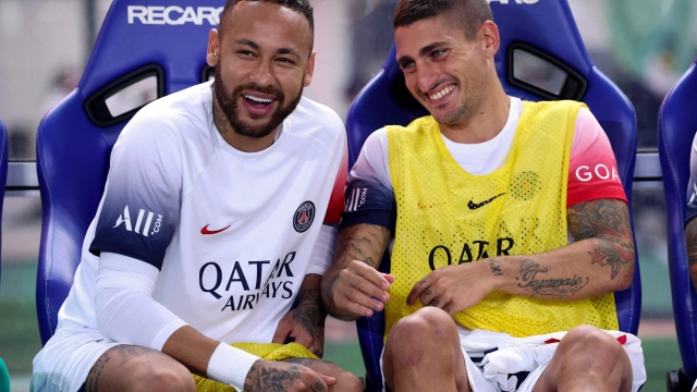 Paris Saint-Germain's Neymar Jr (L) and Marco Verratti look on from the bench before the friendly football match between France's Paris Saint-Germain and Japan's Cerezo Osaka at Nagai Stadium in Osaka on July 28, 2023. (Photo by PAUL MILLER / AFP)