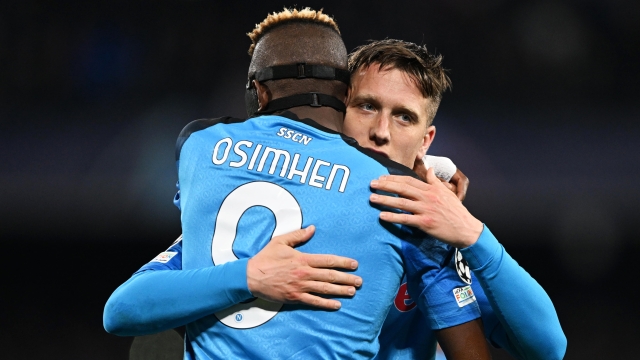 NAPLES, ITALY - MARCH 15: Piotr Zielinski of SSC Napoli celebrates with Victor Osimhen after scoring the team's third goal during the UEFA Champions League round of 16 leg two match between SSC Napoli and Eintracht Frankfurt at Stadio Diego Armando Maradona on March 15, 2023 in Naples, Italy. (Photo by Francesco Pecoraro/Getty Images)