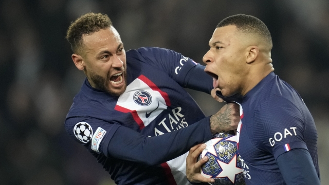 FILE - PSG's Kylian Mbappe, right, celebrates with PSG's Neymar after scoring a disallowed goal during the Champions League round of 16 first leg soccer match between Paris Saint Germain and Bayern Munich, at the Parc des Princes stadium, in Paris, France, Tuesday, Feb. 14, 2023. (AP Photo/Christophe Ena, File)