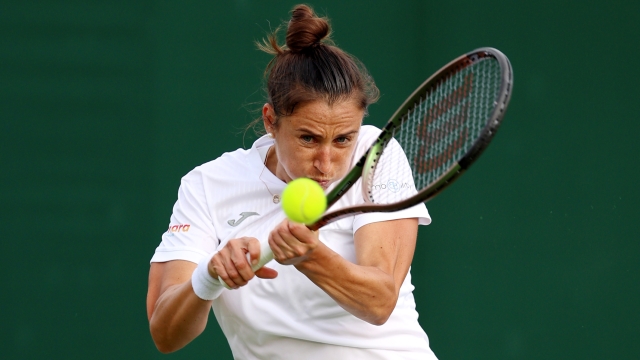 LONDON, ENGLAND - JULY 03: Sara Sorribes Tormo of Spain plays a backhand against Martina Trevisan of Italy in the Women's Singles first round match on day one of The Championships Wimbledon 2023 at All England Lawn Tennis and Croquet Club on July 03, 2023 in London, England. (Photo by Clive Brunskill/Getty Images)