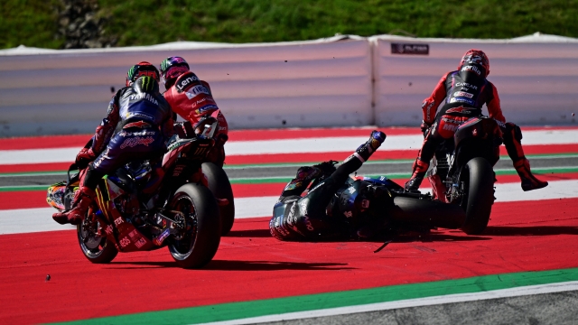 Riders crash at the start of the sprint race at the Red Bull Ring race track in Spielberg, Austria on August 19, 2023, ahead of the MotoGP Austrian Grand Prix. (Photo by Jure Makovec / AFP)