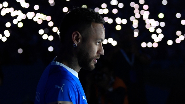 CORRECTION / Brazilian superstar Neymar enters the pitch during his unveiling ceremony at Riyadh's King Fahd International Stadium on August 19, 2023 as he becomes the latest world-famous footballer snapped up by the big-spending Saudi Pro League. (Photo by AFP) / The erroneous mention[s] appearing in the metadata of this photo has been modified in AFP systems in the following manner: [STR] instead of [FAYEZ]. Please immediately remove the erroneous mention[s] from all your online services and delete it (them) from your servers. If you have been authorized by AFP to distribute it (them) to third parties, please ensure that the same actions are carried out by them. Failure to promptly comply with these instructions will entail liability on your part for any continued or post notification usage. Therefore we thank you very much for all your attention and prompt action. We are sorry for the inconvenience this notification may cause and remain at your disposal for any further information you may require.