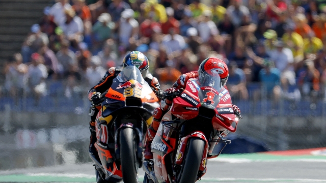 Ducati Lenovo Team Italian rider Francesco Bagnaia (R) and Red Bull KTM Factory Racing South African rider Brad Binder compete during the MotoGP Austrian Grand Prix at the Red Bull Ring racetrack in Spielberg bei Knittelfeld, Austria, on August 20, 2023. (Photo by ERWIN SCHERIAU / APA / AFP) / Austria OUT