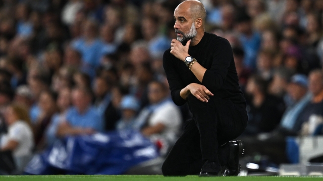 Manchester City's Spanish manager Pep Guardiola reacts during the English Premier League football match between Manchester City and Newcastle United at the Etihad Stadium in Manchester, north west England, on August 19, 2023. (Photo by Paul ELLIS / AFP) / RESTRICTED TO EDITORIAL USE. No use with unauthorized audio, video, data, fixture lists, club/league logos or 'live' services. Online in-match use limited to 120 images. An additional 40 images may be used in extra time. No video emulation. Social media in-match use limited to 120 images. An additional 40 images may be used in extra time. No use in betting publications, games or single club/league/player publications. /