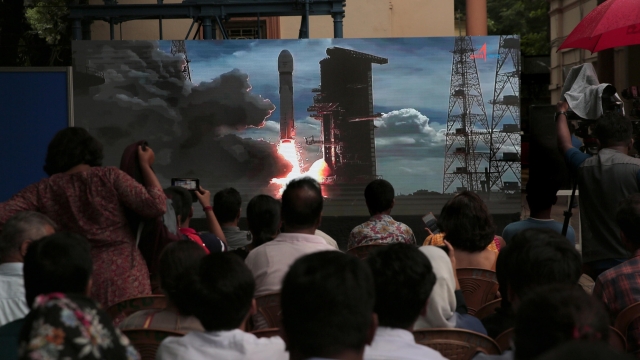 epa10815633 Visitors gather in fornt of  a big screen during the Birla Industrial and Technological Museum (BITM) live telecast of the Chandrayaan-3 Mission soft landing on the Moon, in Kolkata, India 23 August 2023. Chandrayaan-3 is the third and most recent Indian lunar exploration mission under the Chandrayaan program of the Indian Space Research Organization (ISRO) and India became only the fourth nation ever to accomplish such a mission when the craft landed near the Moon's south pole on 23 August.  EPA/PIYAL ADHIKARY Coverage 25935
