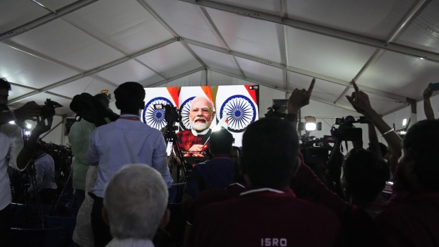 Indian Space Research Organization (ISRO) staff watch prime minister Narendra Modi speak after the successful landing of spacecraft Chandrayaan-3 on the moon at ISRO's Telemetry, Tracking and Command Network facility in Bengaluru, India, Wednesday, Aug. 23, 2023. India has landed a spacecraft near the moon's south pole, an unchartered territory that scientists believe could hold vital reserves of frozen water and precious elements, as the country cements its growing prowess in space and technology.(AP Photo/Aijaz Rahi)