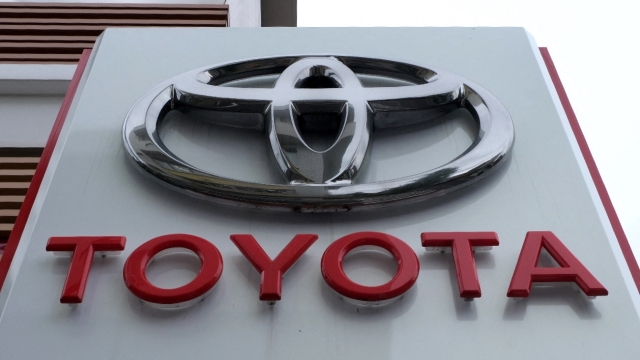 (FILES) The logo of Japans Toyota Motor is displayed at a car showroom in Tokyo on August 4, 2022. Toyota said on August 29, 2023, it halted operations at 12 of its 14 factories in Japan due to a system glitch, but that it did not appear to be a cyberattack. (Photo by Kazuhiro NOGI / AFP)