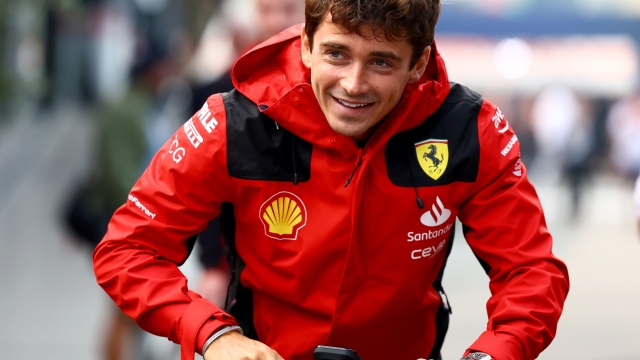 ZANDVOORT, NETHERLANDS - AUGUST 25: Charles Leclerc of Monaco and Ferrari rides a scooter in the Paddock prior to practice ahead of the F1 Grand Prix of The Netherlands at Circuit Zandvoort on August 25, 2023 in Zandvoort, Netherlands. (Photo by Mark Thompson/Getty Images)