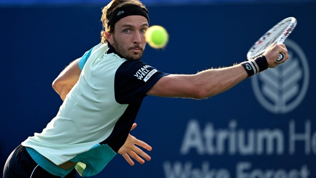 WINSTON SALEM, NORTH CAROLINA - AUGUST 21: Arthur Rinderknech of France returns a shjot against Omni Kumar of the United States during Day Two of the Winston-Salem Open at Wake Forest Tennis Complex on August 21, 2023 in Winston Salem, North Carolina.   Grant Halverson/Getty Images/AFP (Photo by GRANT HALVERSON / GETTY IMAGES NORTH AMERICA / Getty Images via AFP)