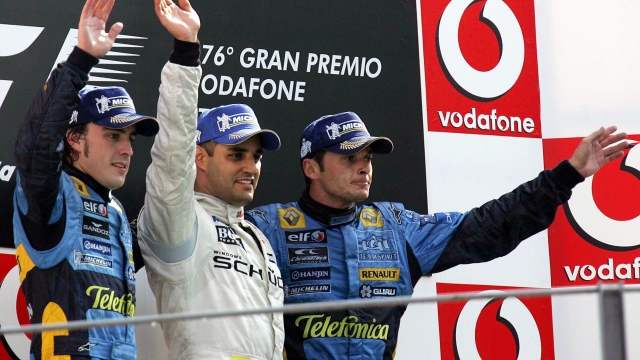 20050904 - MONZA (MILANO) - SPR - FORMULA 1: MONZA; VITTORIA MONTOYA - Alonso, Montoya  e Fisichella sul podio dopo il GP d' Italia.  ansa carlo ferraro /DEF