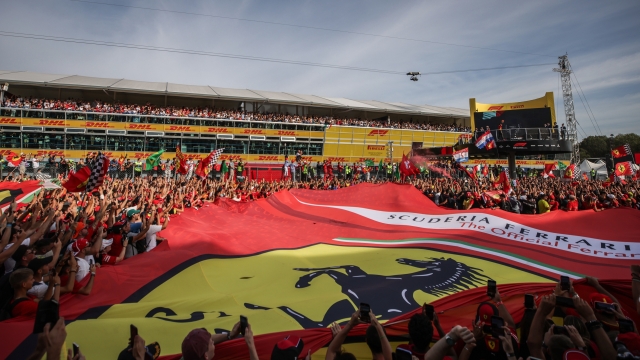MONZA, ITALY - SEPTEMBER 03: A general view as the Tifosi celebrate as Third placed Carlos Sainz of Spain and Ferrari walks onto the podium during the F1 Grand Prix of Italy at Autodromo Nazionale Monza on September 03, 2023 in Monza, Italy. (Photo by Ryan Pierse/Getty Images)