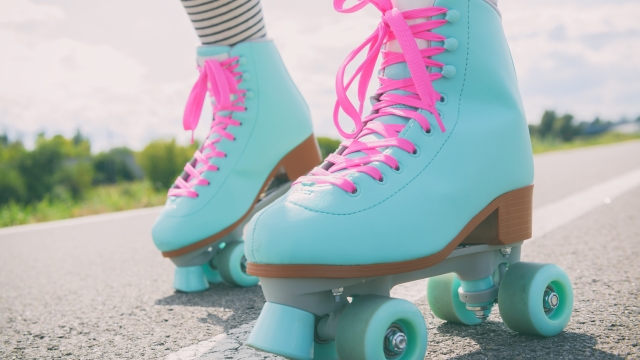 Woman rollerskater wearing roller skates with pink laces